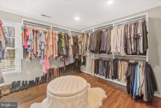 spacious closet with visible vents and wood finished floors