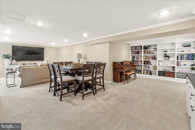 dining room featuring recessed lighting, baseboards, crown molding, and light colored carpet