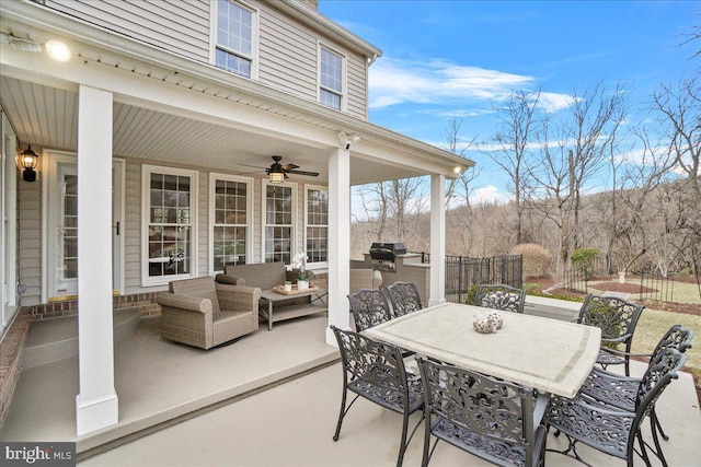 view of patio / terrace with outdoor lounge area, a ceiling fan, and outdoor dining space