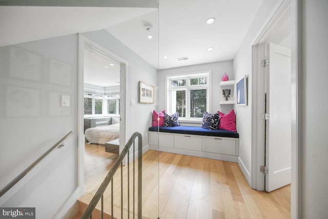 mudroom featuring recessed lighting, light wood-type flooring, a healthy amount of sunlight, and visible vents