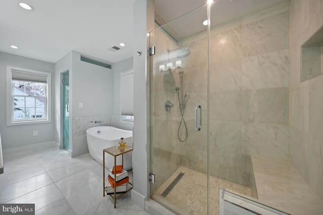 bathroom featuring visible vents, recessed lighting, tile walls, a shower stall, and a soaking tub