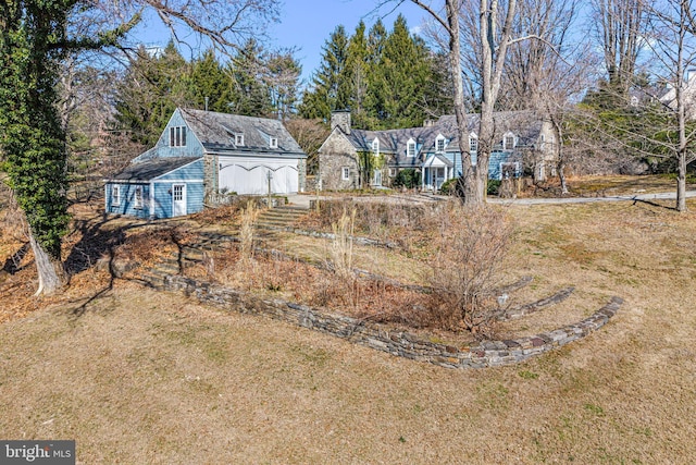 back of property featuring a yard