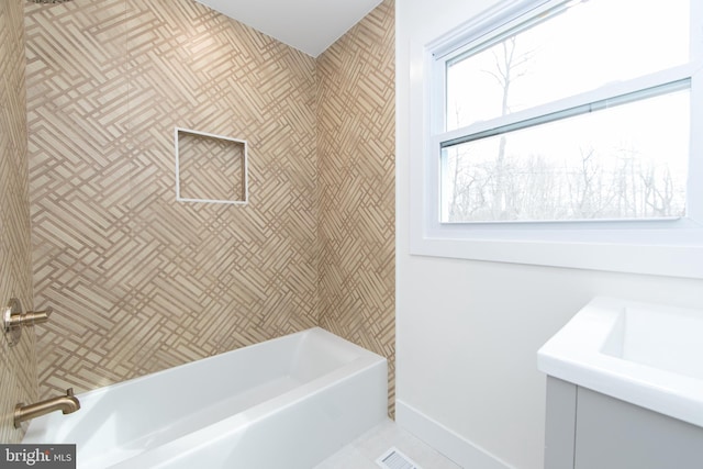 full bathroom with baseboards and shower / bathtub combination