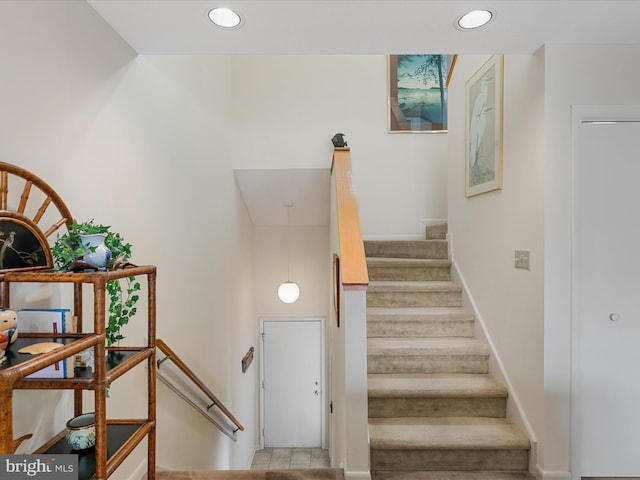 staircase featuring recessed lighting and baseboards