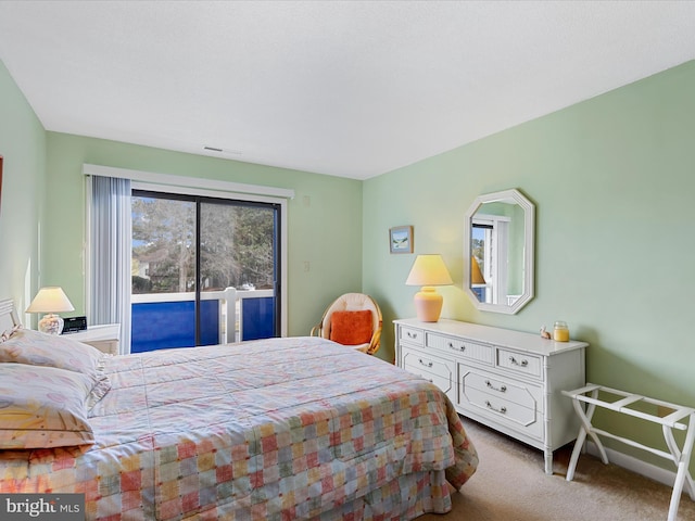 carpeted bedroom featuring access to exterior