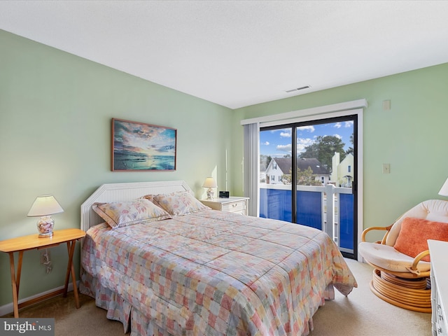 bedroom featuring access to exterior, carpet, visible vents, and baseboards