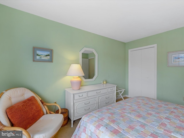 carpeted bedroom featuring a closet