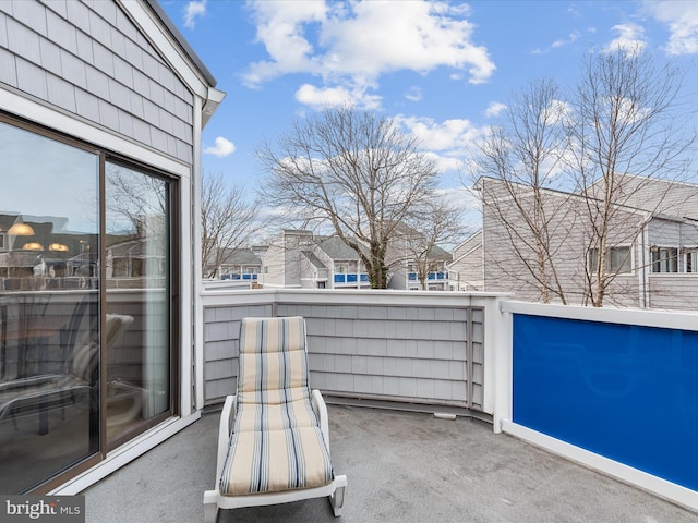 view of patio featuring a balcony