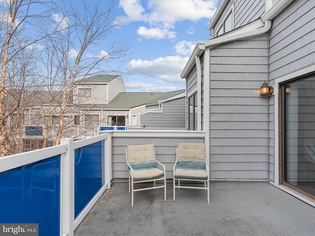 view of patio featuring a balcony