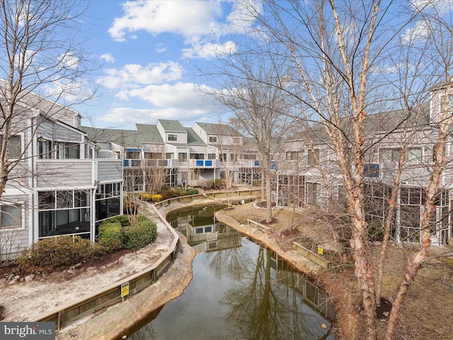 view of community featuring a residential view and a water view