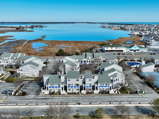 aerial view with a residential view and a water view