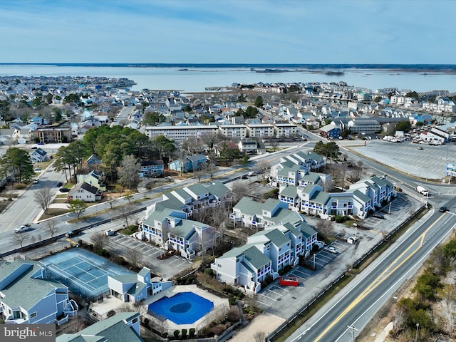 drone / aerial view featuring a residential view and a water view