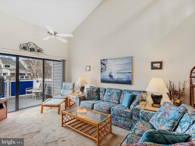 living room with carpet, ceiling fan, and high vaulted ceiling