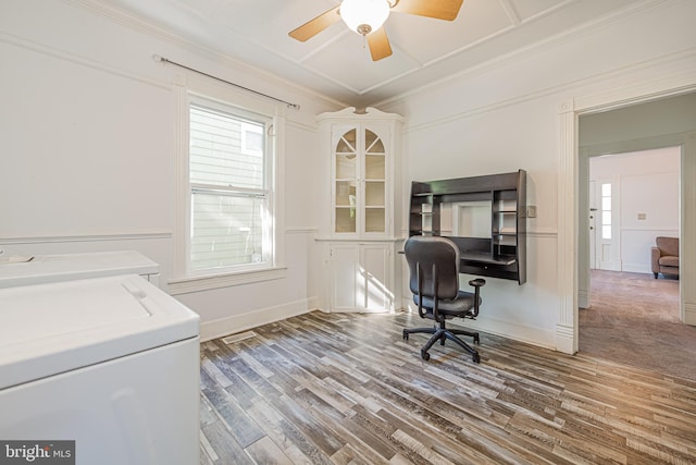 home office featuring separate washer and dryer, wood finished floors, a ceiling fan, baseboards, and crown molding