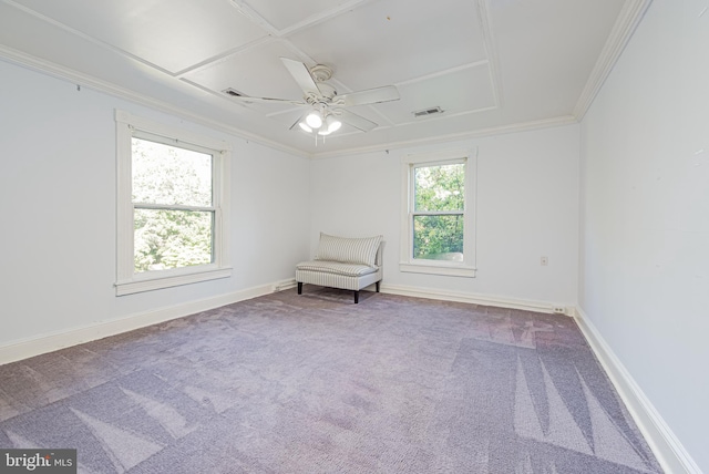 unfurnished room with carpet flooring, visible vents, baseboards, a ceiling fan, and crown molding