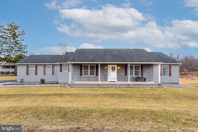 ranch-style home with covered porch and a front lawn