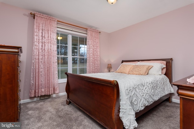 bedroom with carpet and baseboards