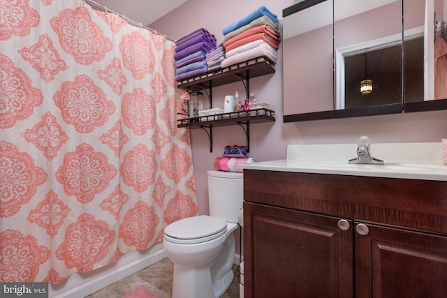 full bathroom featuring toilet, vanity, and a shower with shower curtain