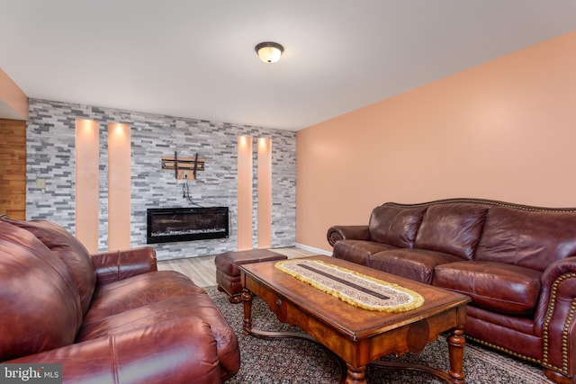 living area featuring a fireplace and wood finished floors