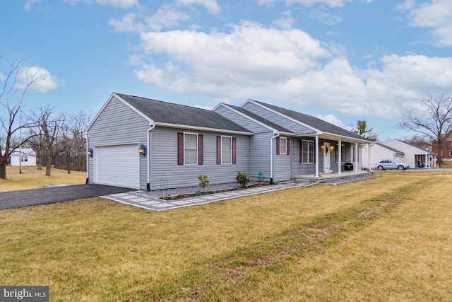 single story home with aphalt driveway, a front yard, a porch, and an attached garage