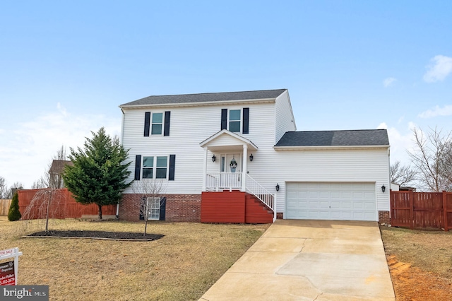 traditional-style house with concrete driveway, a front lawn, fence, and brick siding