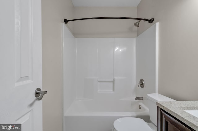 bathroom featuring shower / washtub combination, vanity, and toilet