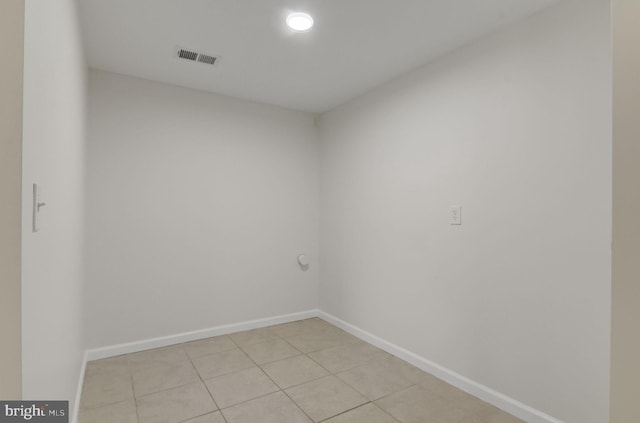 unfurnished room featuring visible vents, baseboards, and light tile patterned floors