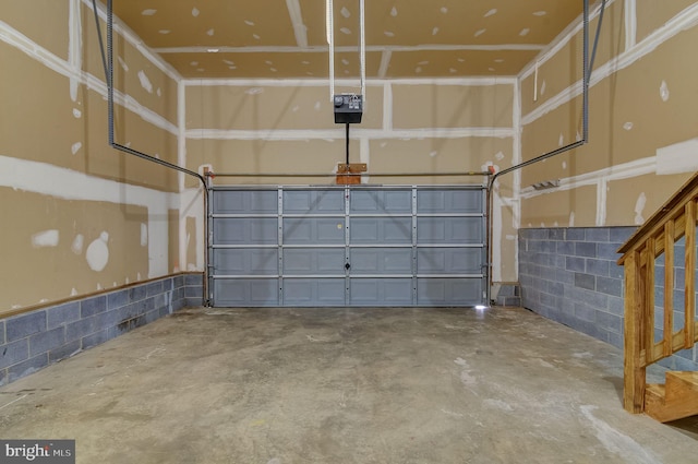 garage with concrete block wall