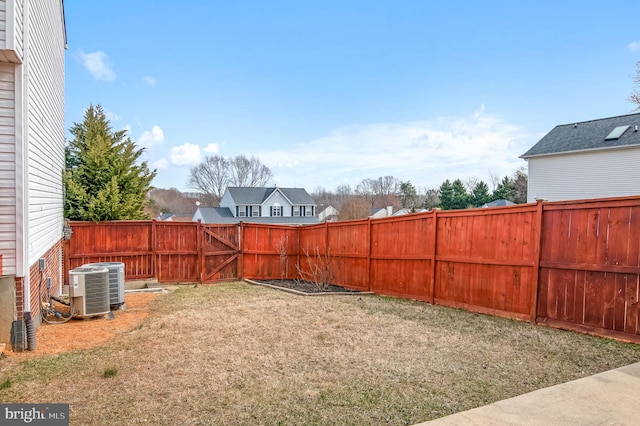 view of yard with a fenced backyard and cooling unit