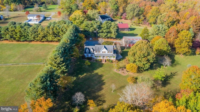 birds eye view of property featuring a rural view