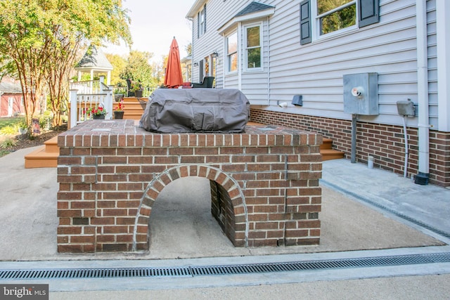 view of patio with a grill