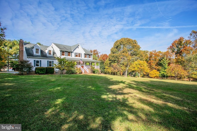 view of yard featuring covered porch