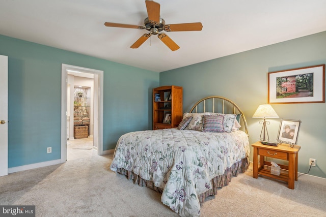 bedroom featuring ceiling fan, carpet floors, ensuite bathroom, and baseboards