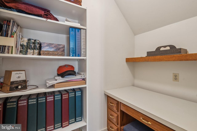 office space with vaulted ceiling