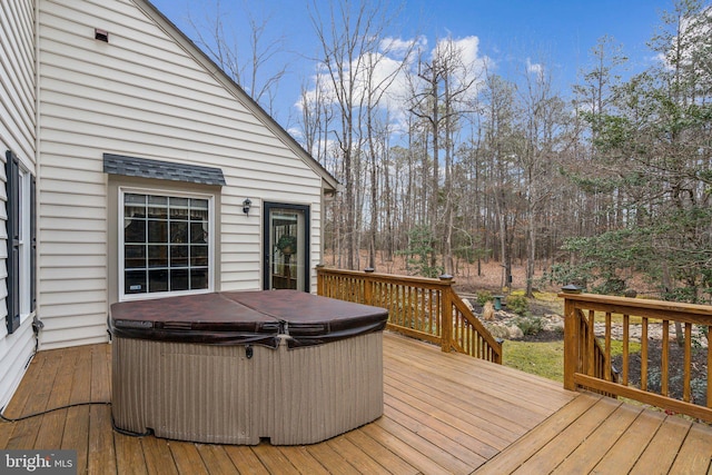 deck with a hot tub