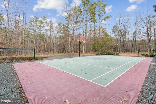 view of sport court featuring community basketball court and fence