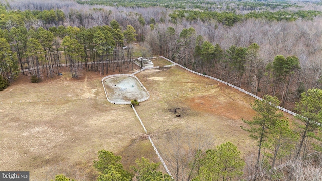 birds eye view of property with a forest view