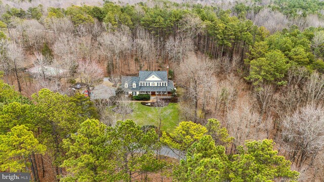 bird's eye view featuring a wooded view