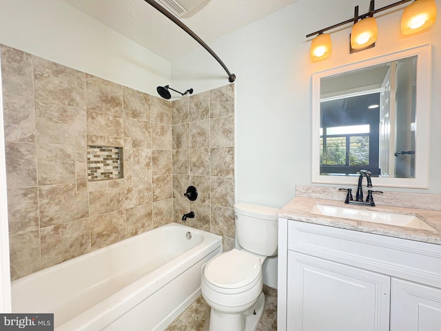 full bathroom featuring toilet,  shower combination, a textured ceiling, and vanity