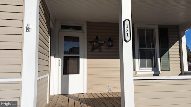 doorway to property with covered porch