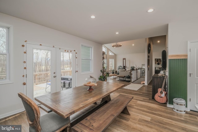 dining area featuring light wood-style floors, recessed lighting, french doors, and baseboards