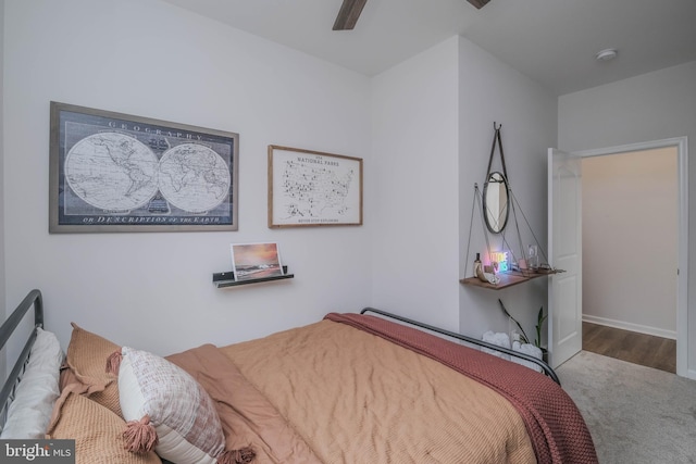 carpeted bedroom featuring ceiling fan and baseboards