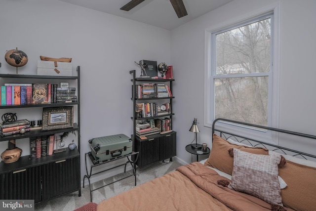 carpeted bedroom featuring baseboards