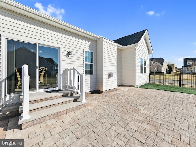 exterior space with fence and a patio