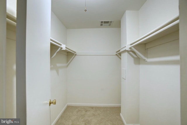 walk in closet featuring carpet floors and visible vents