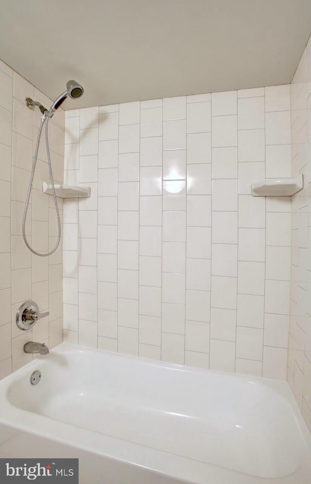 bathroom featuring washtub / shower combination