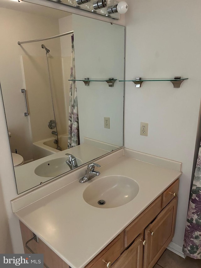 full bathroom with toilet, vanity, and shower / tub combo with curtain