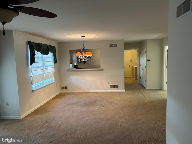 unfurnished dining area featuring visible vents and carpet floors