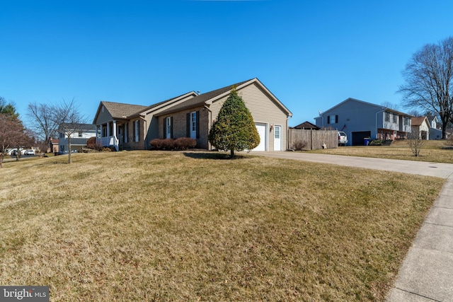 view of front of house featuring brick siding, fence, concrete driveway, a front yard, and a garage