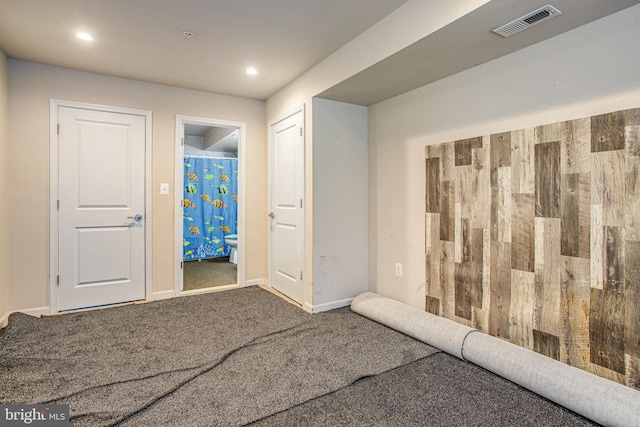 interior space with carpet, visible vents, baseboards, and recessed lighting